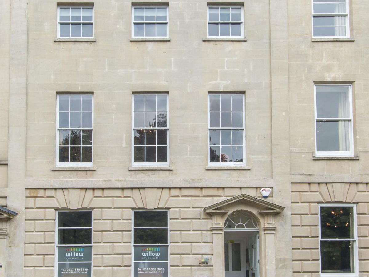 a brick building with windows and a door at 3 Berkeley Square Guesthouse in Bristol